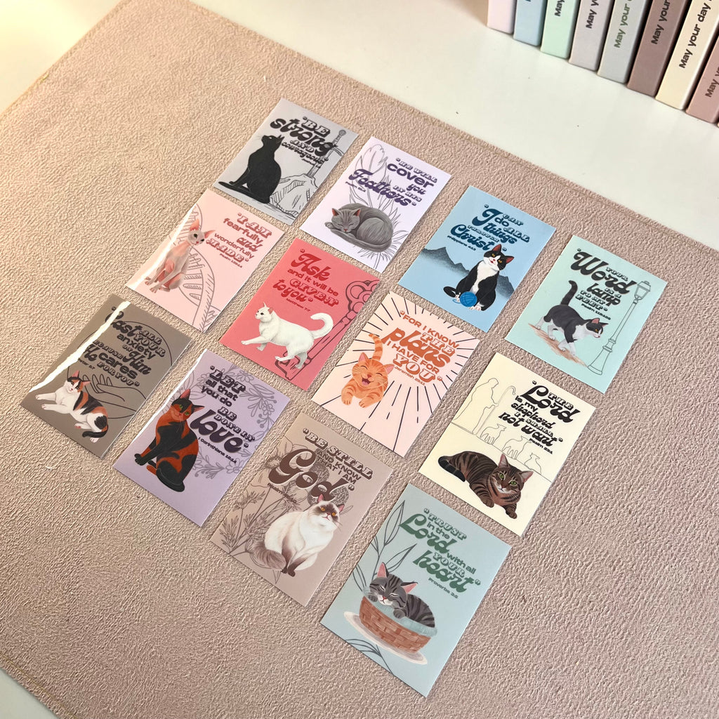 Set of cat-themed stickers on a textured surface