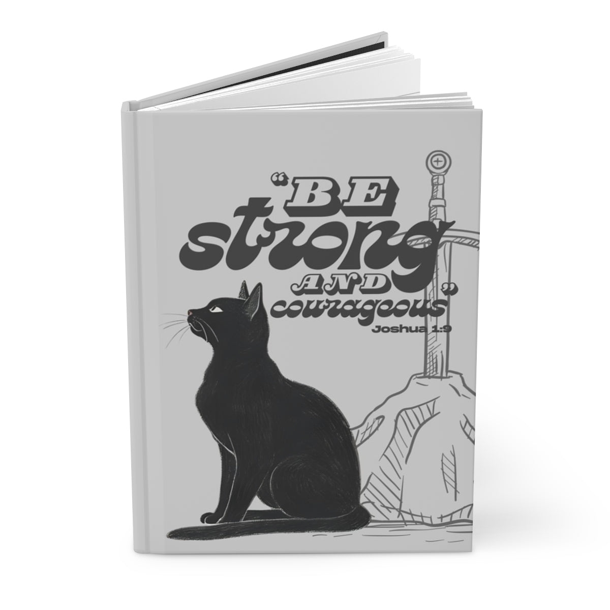 Notebook with a black cat illustration and motivational quote on a white background
