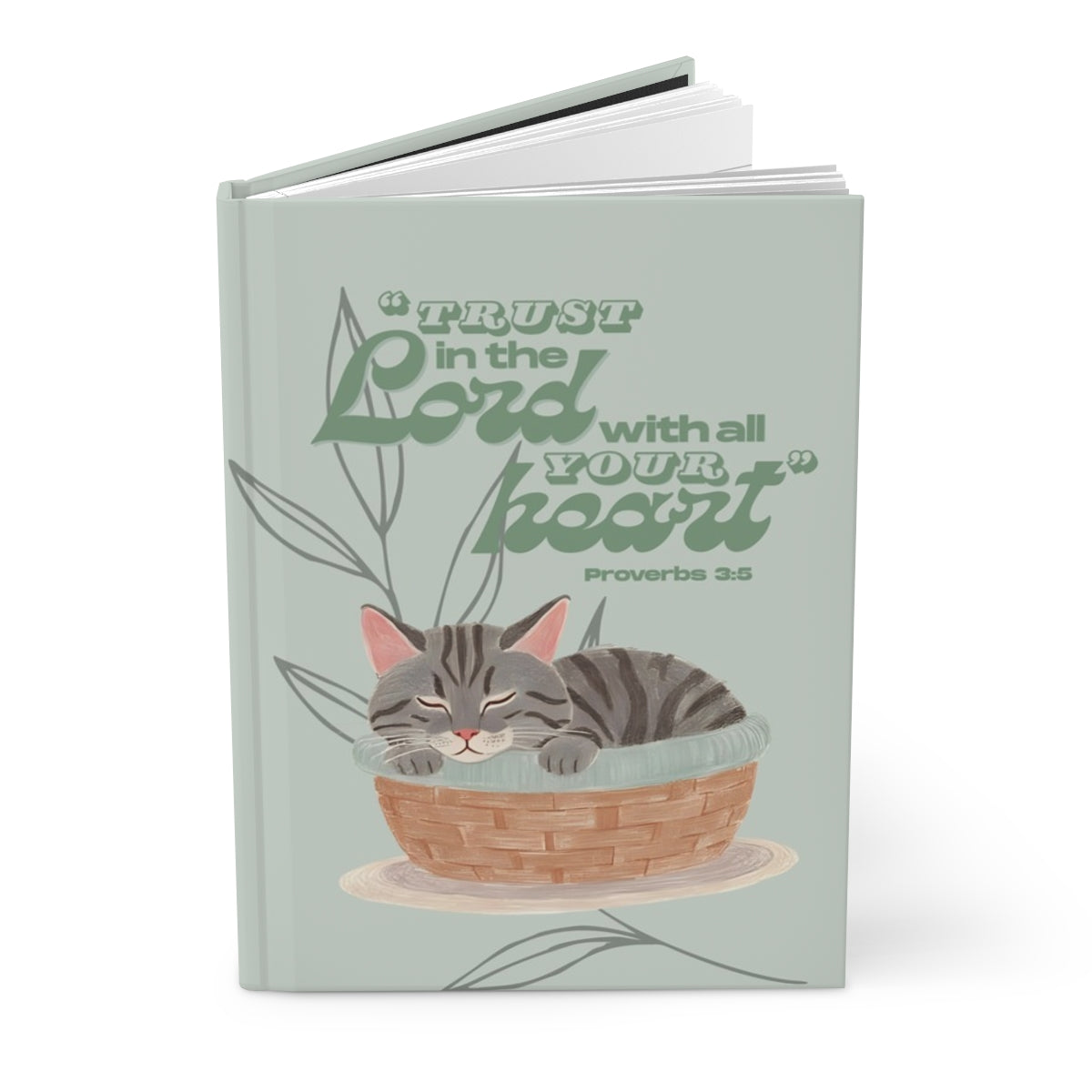 Book with a cat illustration and motivational quote on a light green background