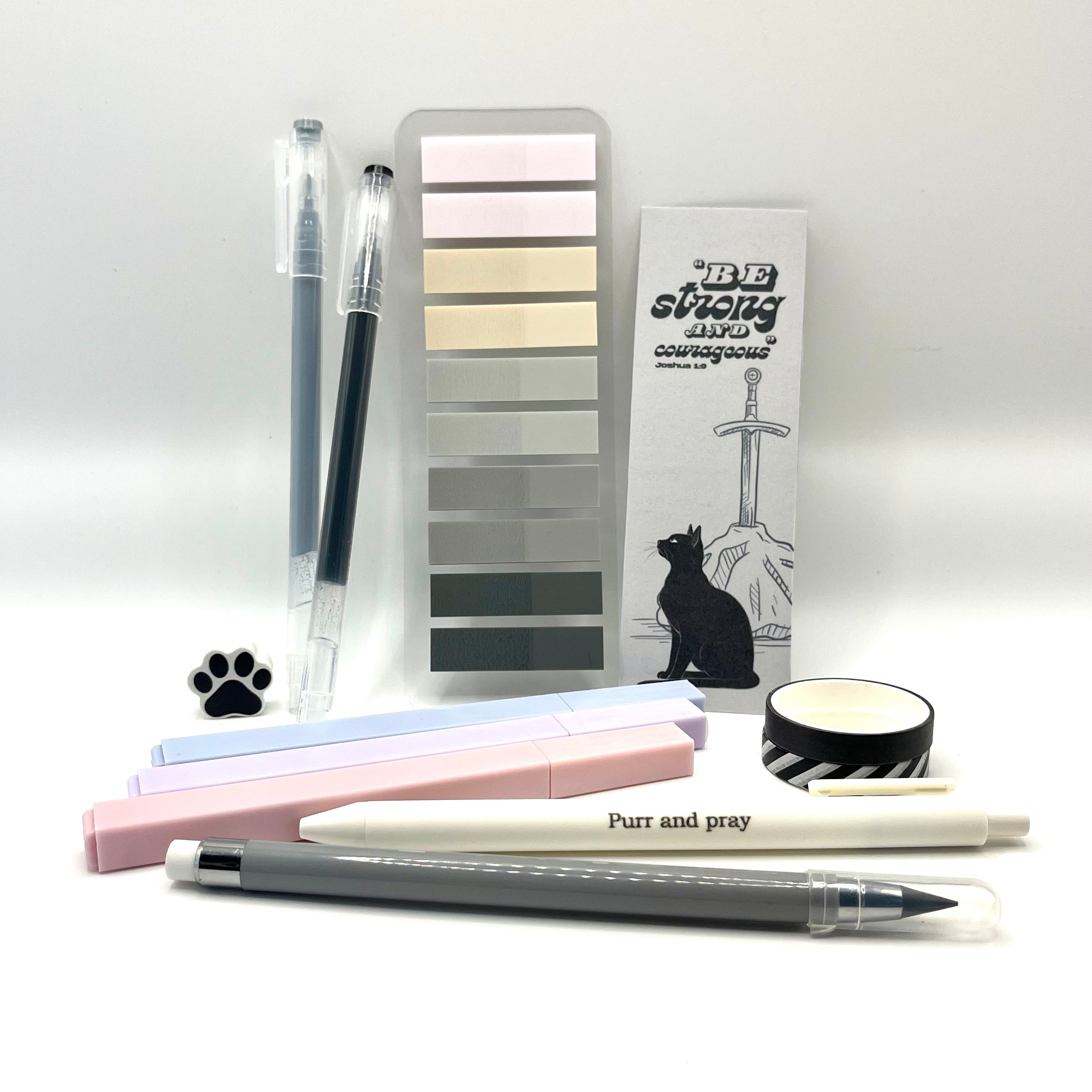 Christian stationery set including highlighters, gel pens, everlasting pencil, sticky notes, washi tape, bookmark, and eraser arranged neatly in gray color palette.