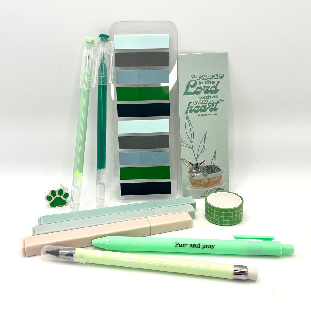 Christian stationery set including highlighters, gel pens, everlasting pencil, sticky notes, washi tape, bookmark, and eraser arranged neatly in green color palette.
