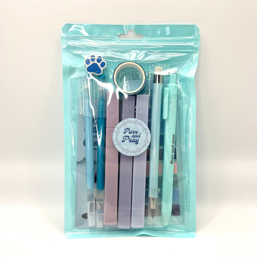 Stationery set packaged in a clear bag including pens, highlighters, sticky notes, washi tape, bookmark, and eraser for Christian journaling arranged neatly in blue color palette.
