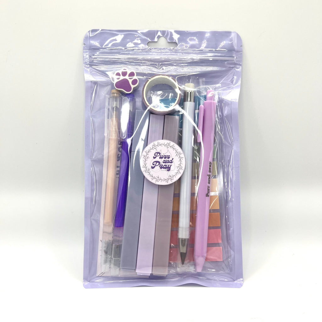 Stationery set packaged in a clear bag including pens, highlighters, sticky notes, washi tape, bookmark, and eraser for Christian journaling arranged neatly in lavender color palette.