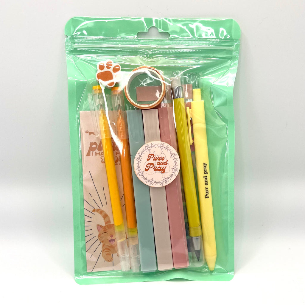 Stationery set packaged in a clear bag including pens, highlighters, sticky notes, washi tape, bookmark, and eraser for Christian journaling arranged neatly in orange color palette.