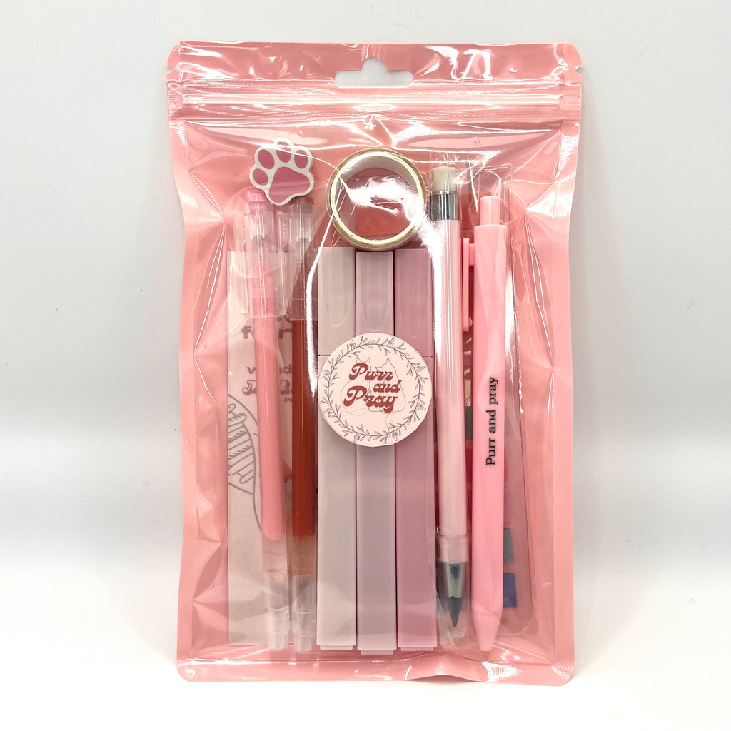 Stationery set packaged in a clear bag including pens, highlighters, sticky notes, washi tape, bookmark, and eraser for Christian journaling arranged neatly in light pink color palette.