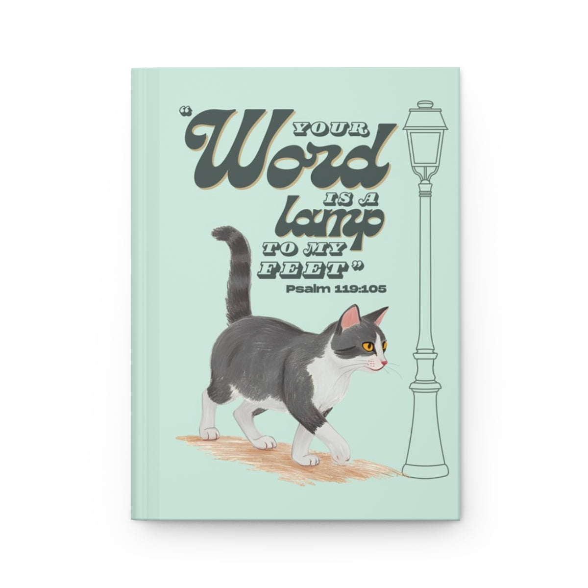 Front cover of A5 Christian journal featuring the Bible verse ‘Your word is a lamp to my feet’ with a gray tuxedo cat illustration.