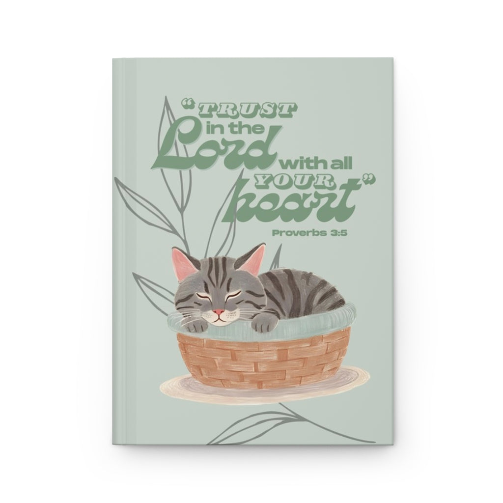 Front cover of A5 Christian journal featuring the Bible verse ‘Trust in the Lord with all your heart’ with a gray tabby cat illustration.