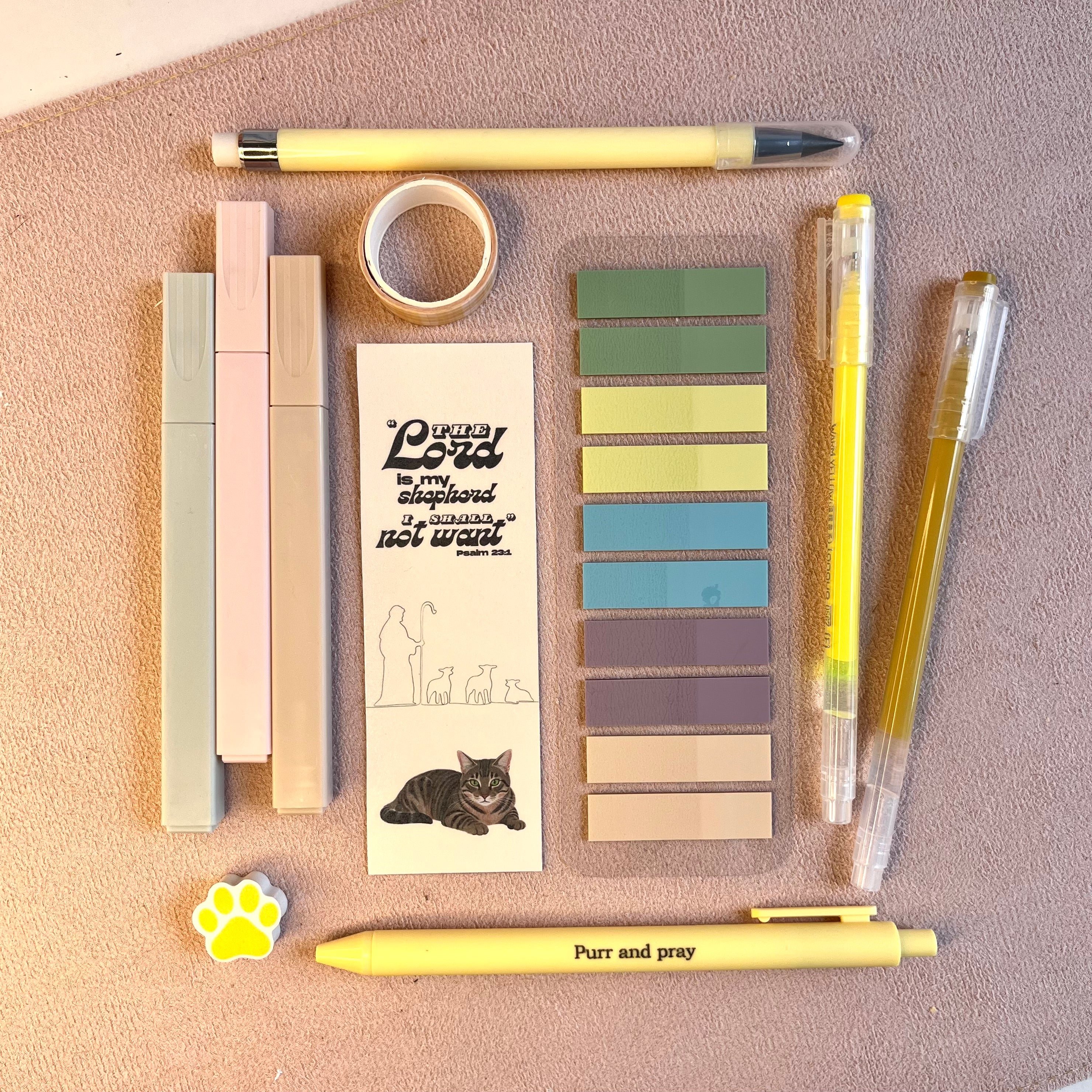 Yellow stationery set including bookmark with a brown tabby cat illustration.