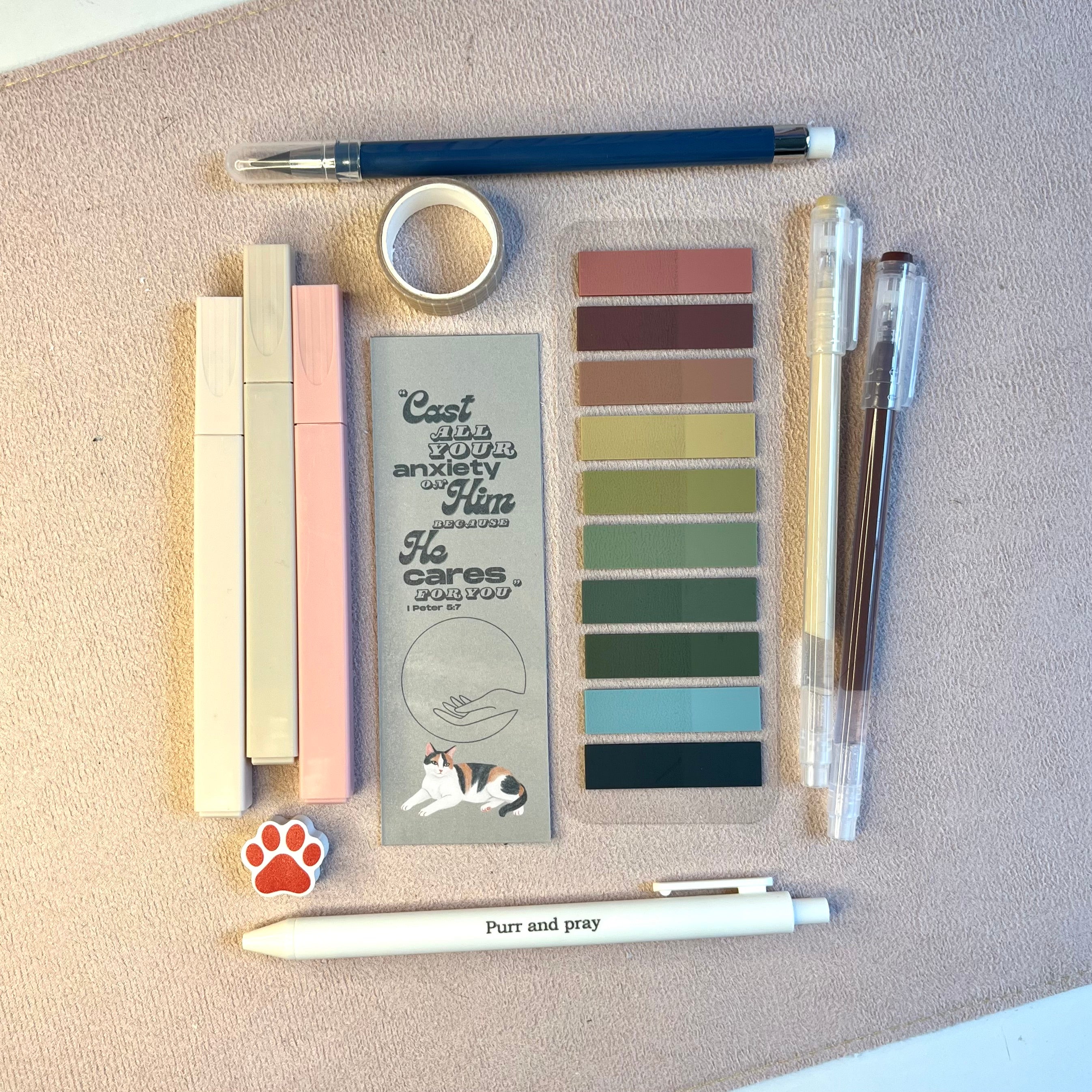 Collection of stationery items in brown color with calico cat illustration.