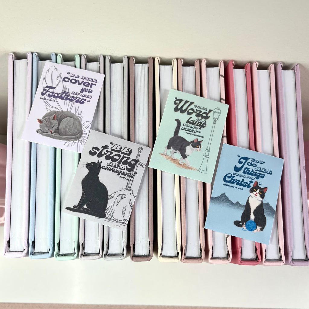 Set of cat-themed stickers on a white surface with a neutral background