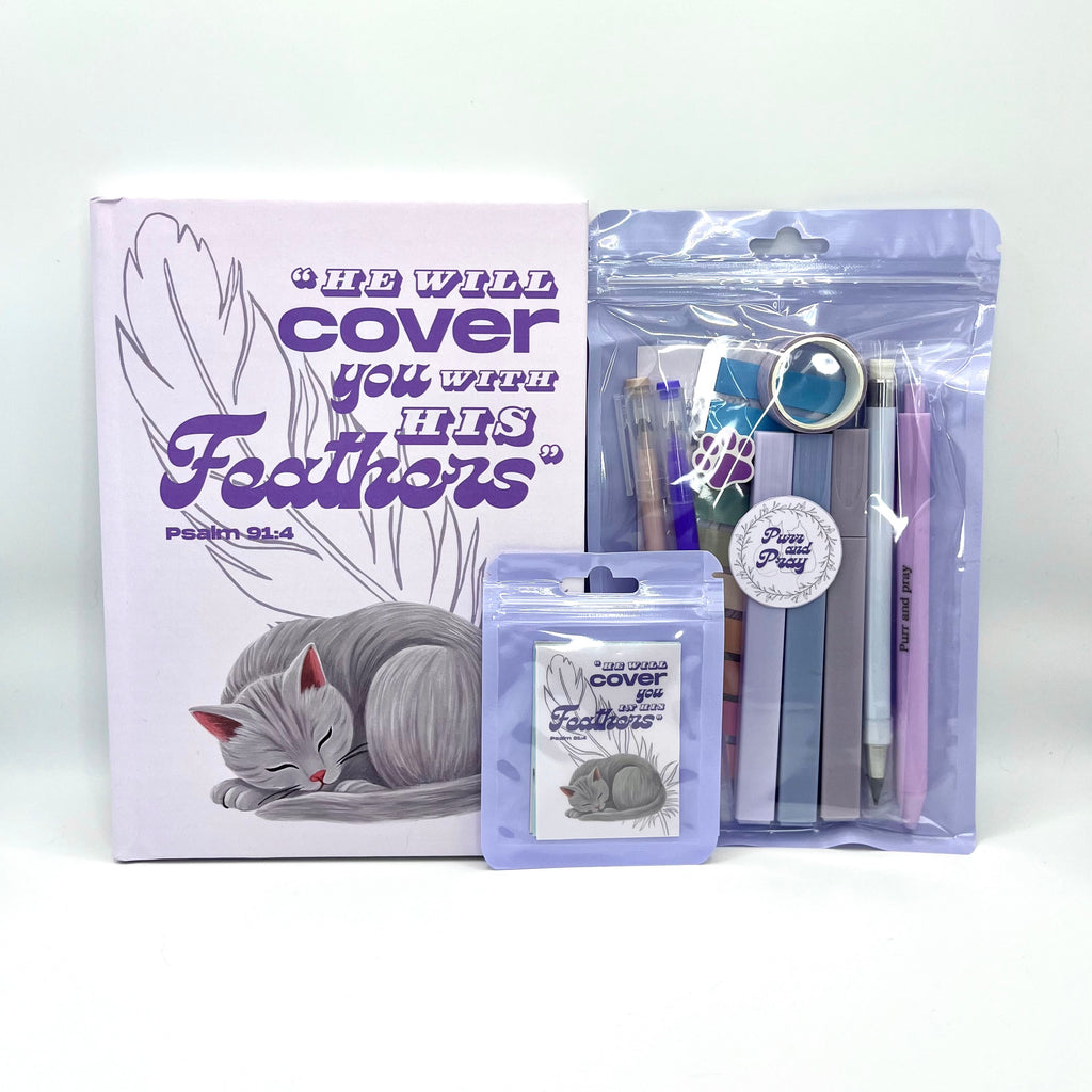 Packaged Christian gift set including a Bible verse journal with a gray cat artwork, stationery items in clear bags, and Scripture sticker pack.