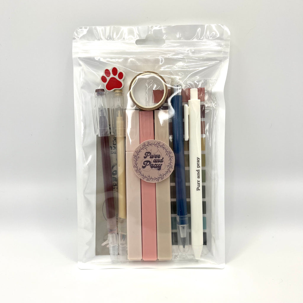 Stationery set packaged in a clear bag including pens, highlighters, sticky notes, washi tape, bookmark, and eraser for Christian journaling arranged neatly in brown color palette.