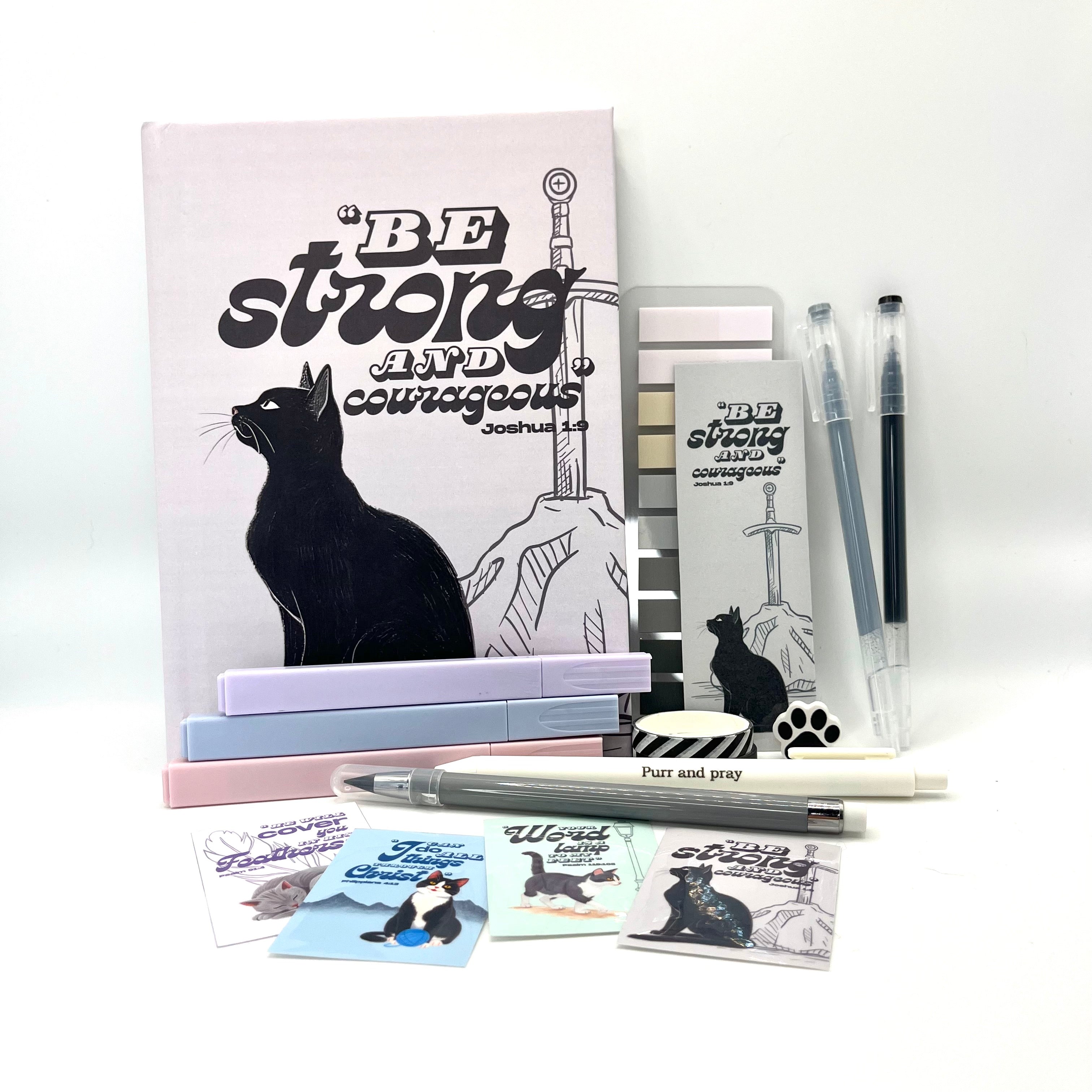 Christian journal gift set with Bible verse journal featuring a black cat illustration, coordinated stationery items, and Scripture stickers.