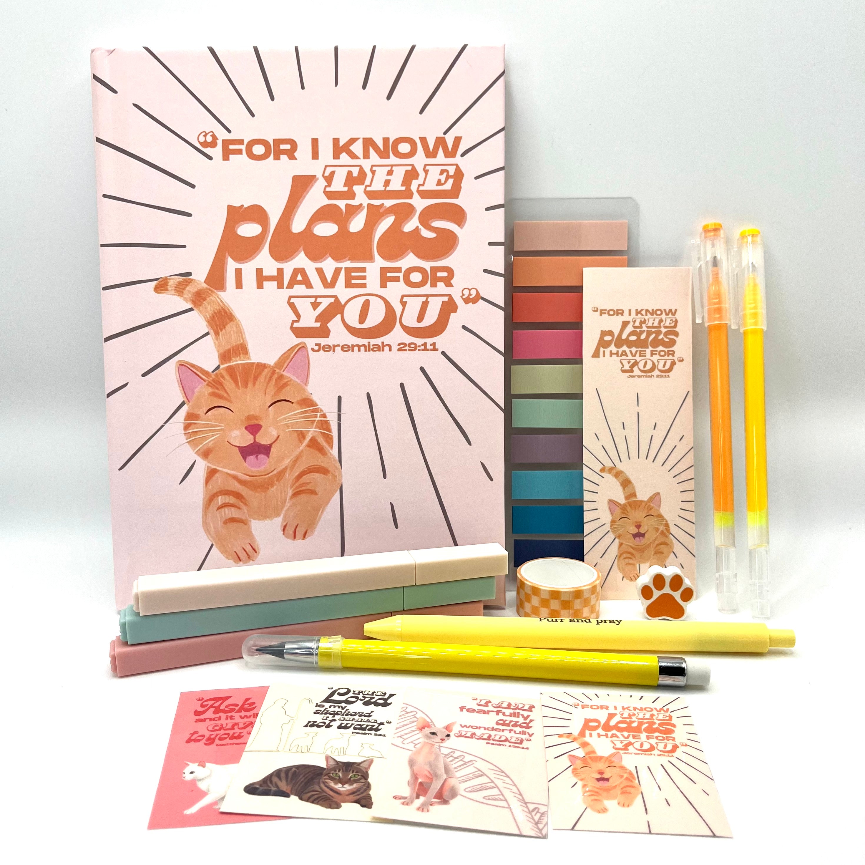 Christian journal gift set with Bible verse journal featuring an orange tabby illustration, coordinated stationery items, and Scripture stickers.