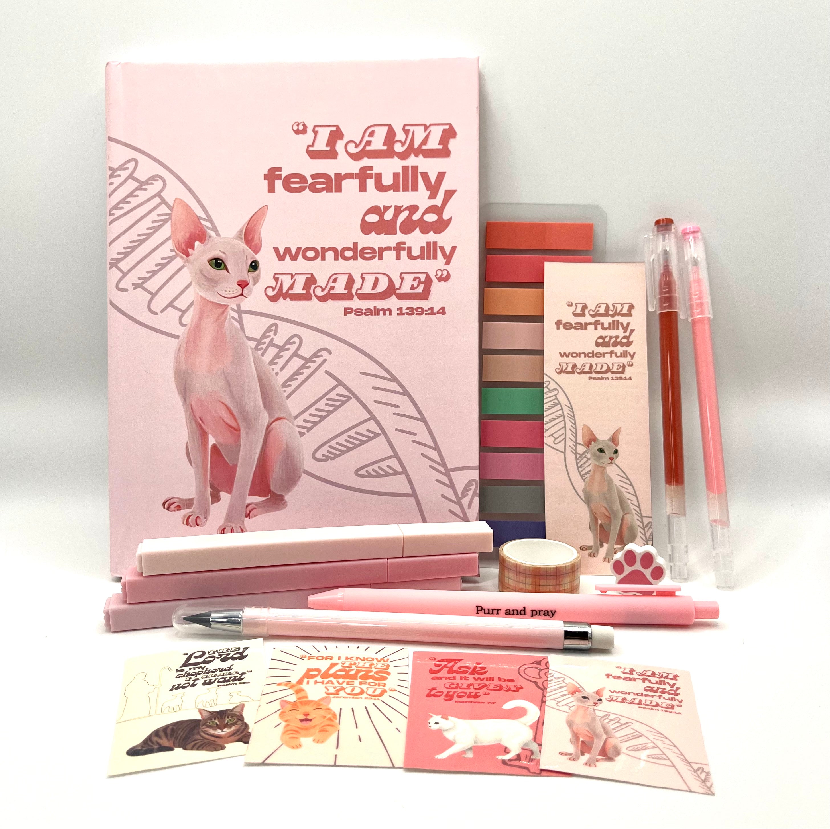 Christian journal gift set with Bible verse journal featuring a sphynx cat illustration, coordinated stationery items, and Scripture stickers.