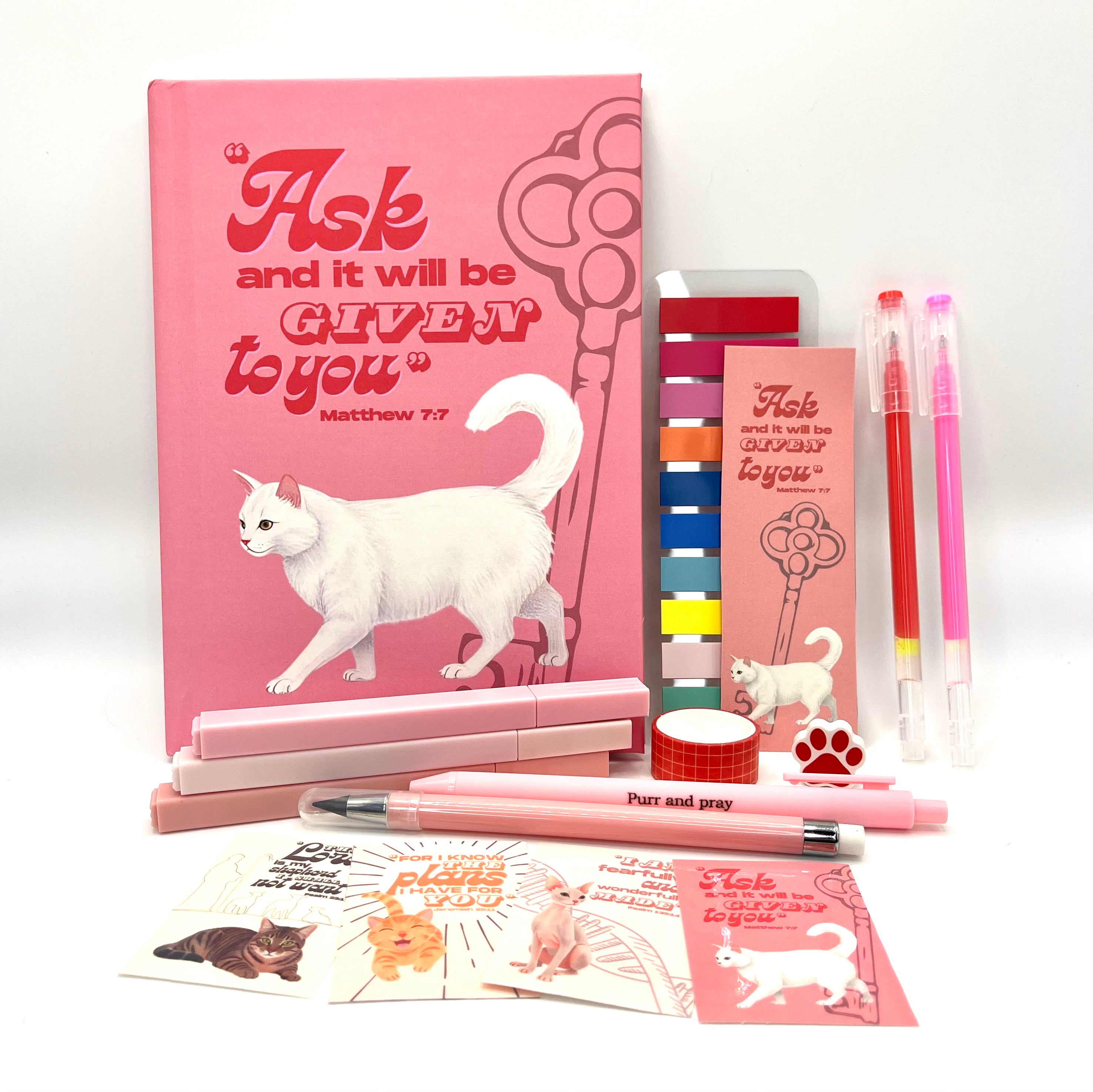 Christian journal gift set with Bible verse journal featuring a white cat illustration, coordinated stationery items, and Scripture stickers.