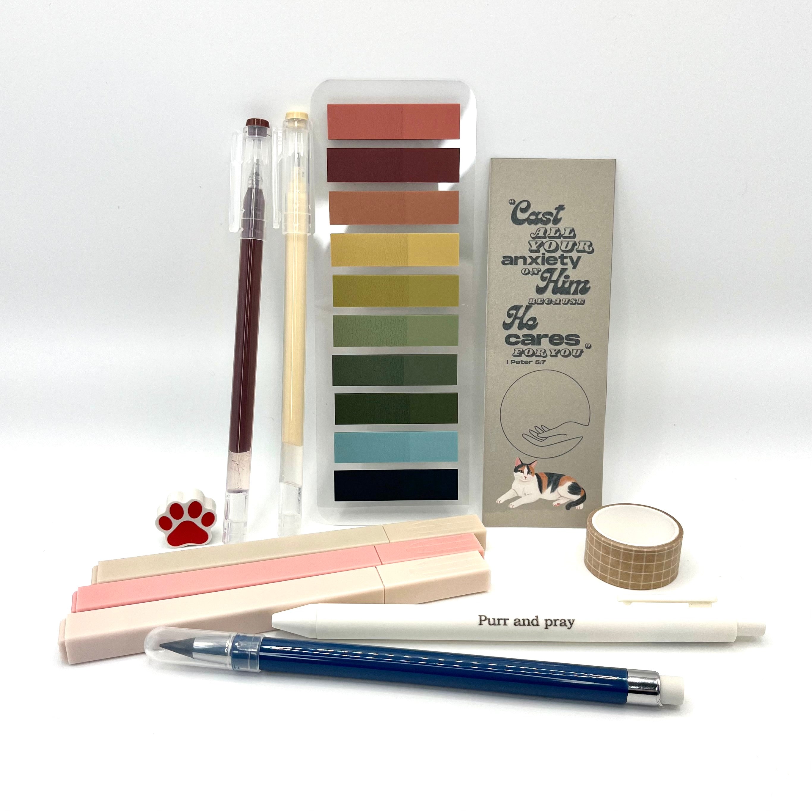 Christian stationery set including highlighters, gel pens, everlasting pencil, sticky notes, washi tape, bookmark, and eraser arranged neatly in brown color palette.