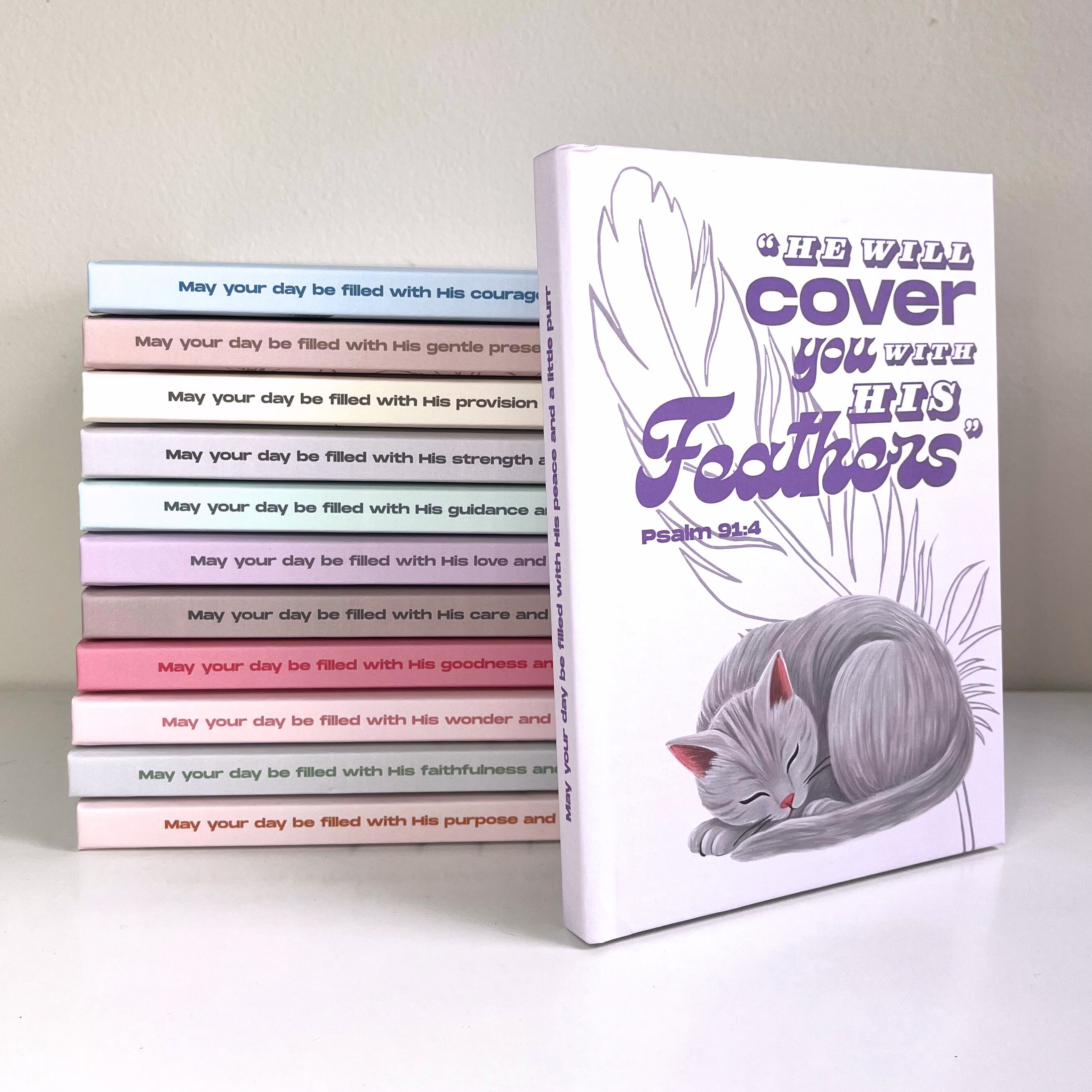 Stack of books with a cat illustration and text on the cover