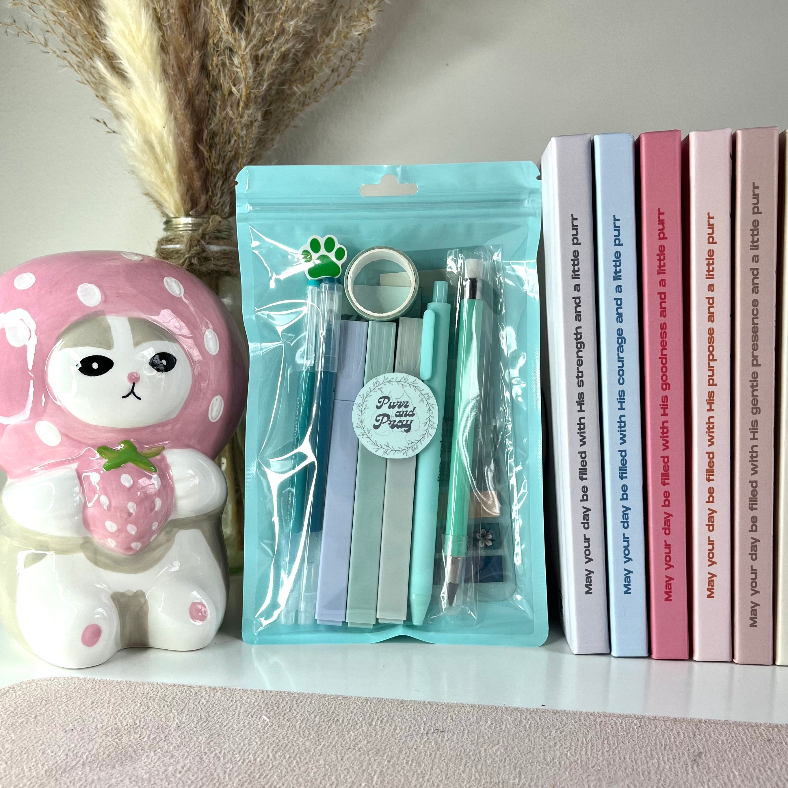 Mint colored packaged stationery items.