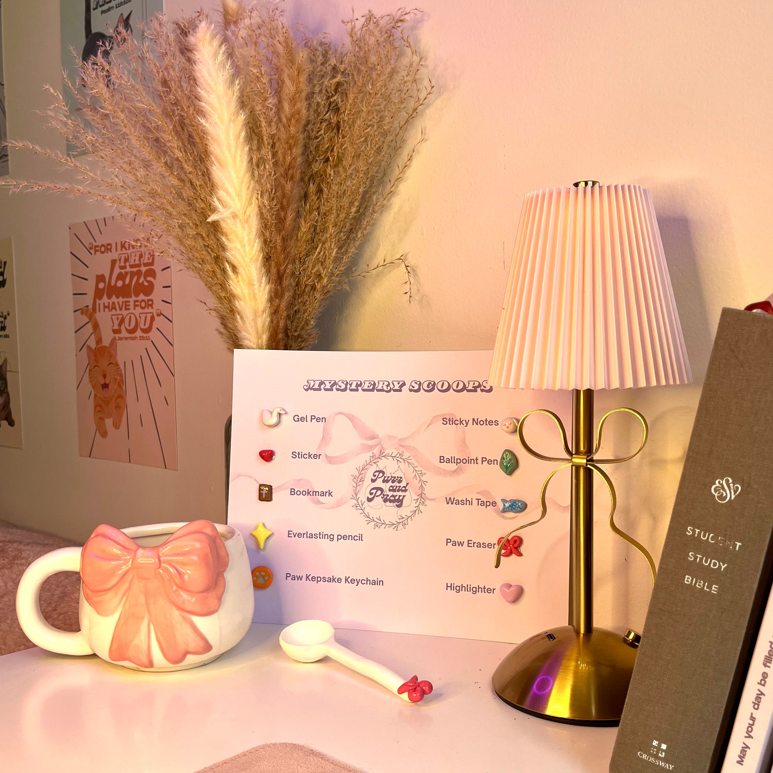 Desk setup with a mug, lamp, and stationery items on a desk.