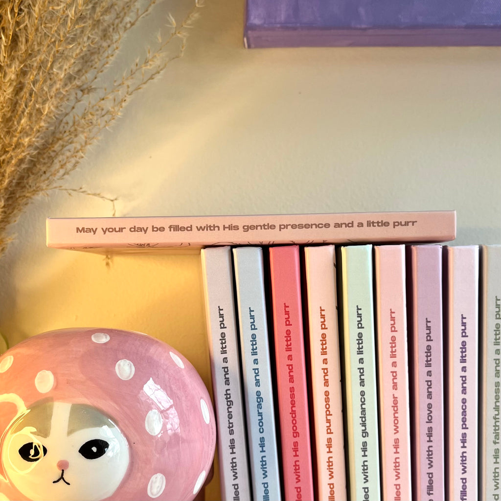 A side of a beige notebook with a christian text on it.