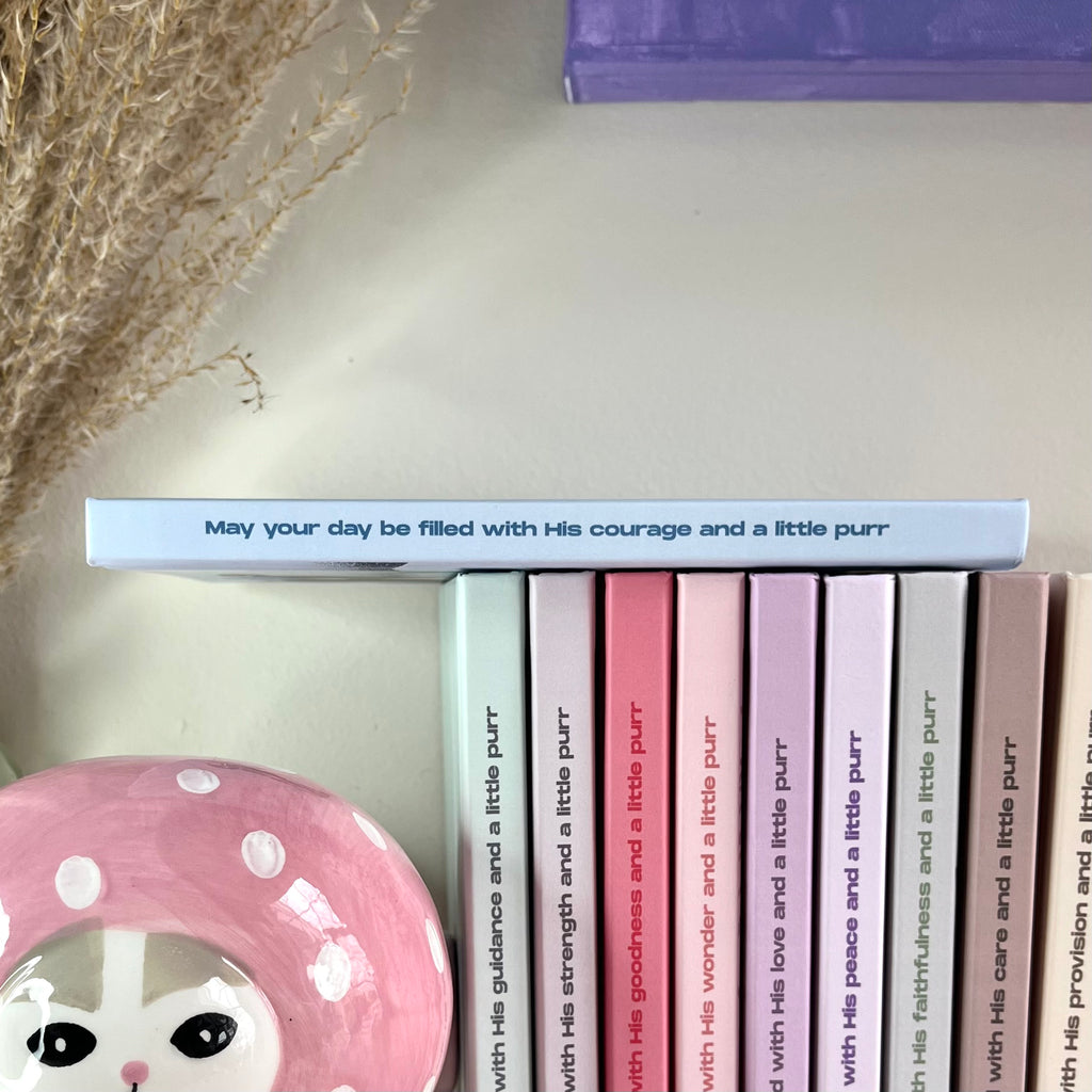 Side of a blue notebook with a christian text on it.